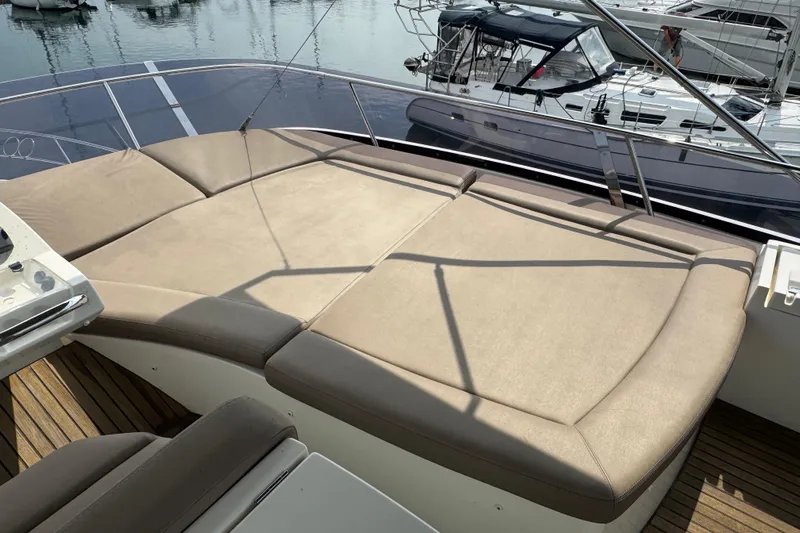  Yacht Photos Pics Luxurious sunbathing deck on 2013 Prestige 500 yacht, docked at marina.
