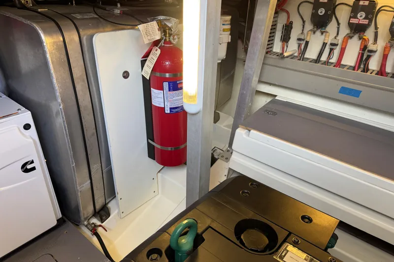  Yacht Photos Pics Engine room of 2013 Prestige 500 yacht with fire extinguisher and electrical components.