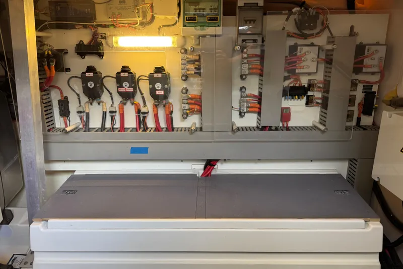  Yacht Photos Pics Electrical panel inside a 2013 Prestige 500 yacht, showcasing wiring and components.