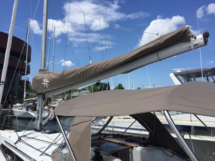 Venteux Yacht Photos Pics 2016 Jeanneau Sun Odyssey 349 sailboat docked at marina under blue sky.