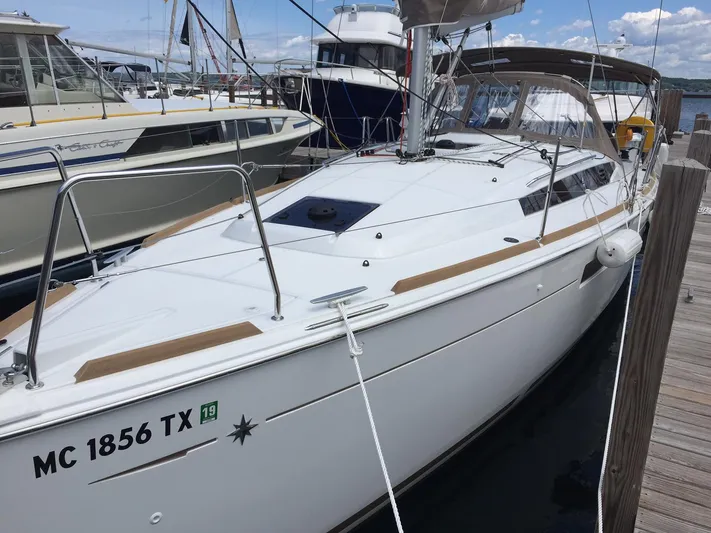 Venteux Yacht Photos Pics 2016 Jeanneau Sun Odyssey 349 sailboat docked at marina, featuring sleek design and white hull.