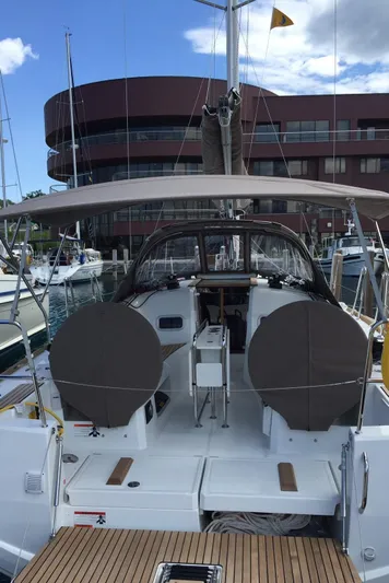 Venteux Yacht Photos Pics Jeanneau Sun Odyssey 349 sailboat, 2016 model, docked at marina with modern architecture.