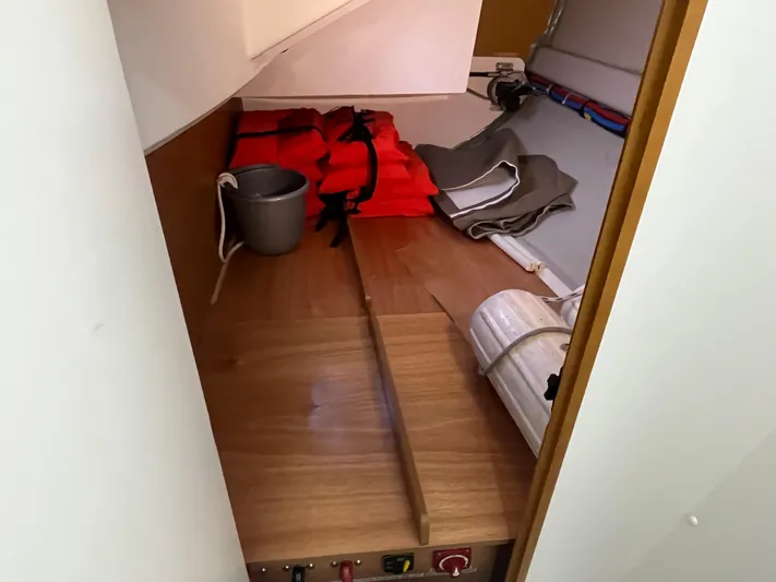 Venteux Yacht Photos Pics Storage area in a 2016 Jeanneau Sun Odyssey 349 sailboat with life jackets and equipment.