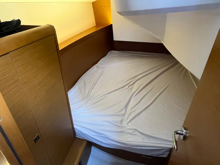 Venteux Yacht Photos Pics Cozy cabin interior of 2016 Jeanneau Sun Odyssey 349 sailboat with wooden finish.