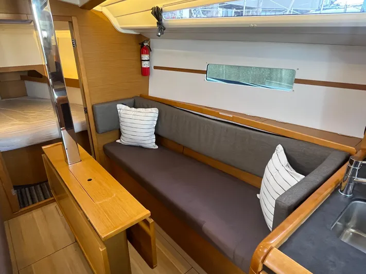 Venteux Yacht Photos Pics Interior of 2016 Jeanneau Sun Odyssey 349 yacht with cozy seating and modern design.
