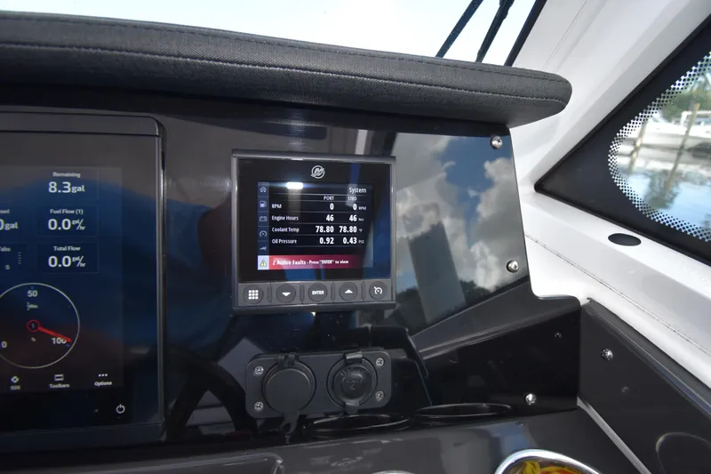  Yacht Photos Pics Dashboard of a 2022 Blackfin 272DC boat showing engine metrics and fuel data.
