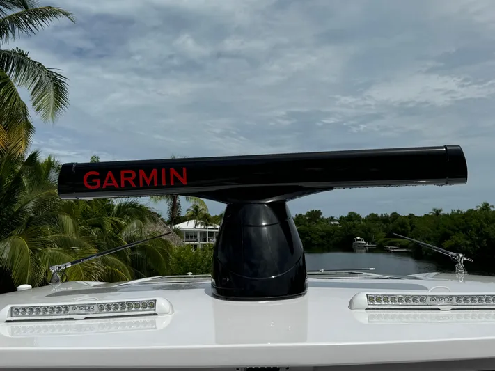  Yacht Photos Pics Garmin radar on 2022 Deep Impact 399 boat, surrounded by tropical scenery.