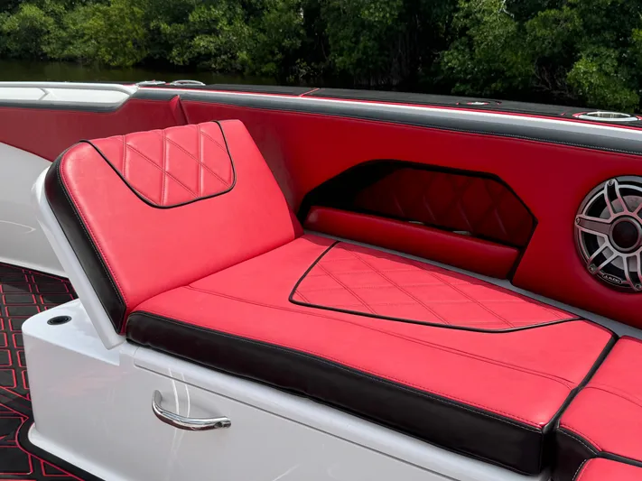  Yacht Photos Pics Luxurious red and black seating on 2022 Deep Impact 399 boat, featuring stylish design.