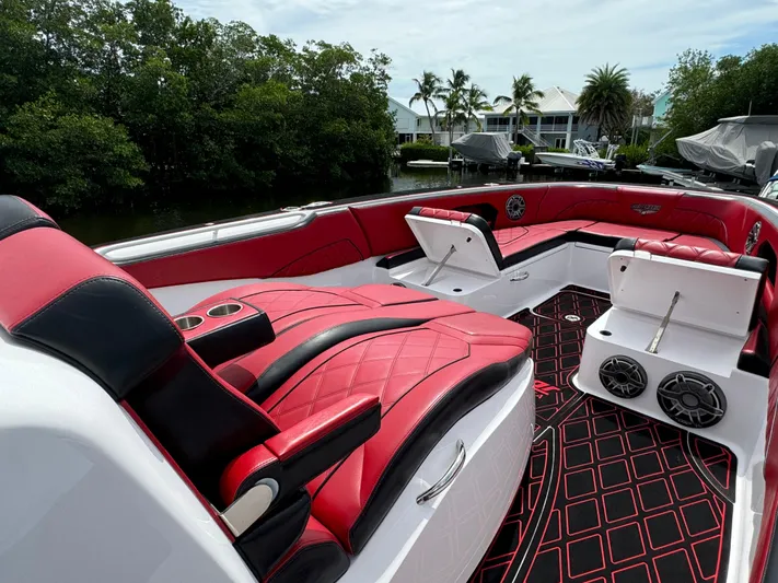  Yacht Photos Pics Luxurious 2022 Deep Impact 399 boat with red and black seating, sleek design, and modern amenities.
