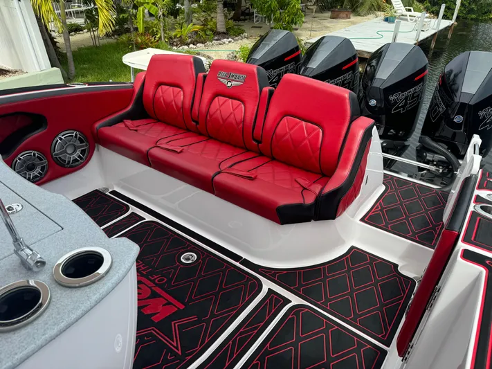  Yacht Photos Pics Red and black seating on 2022 Deep Impact 399 boat with powerful engines.