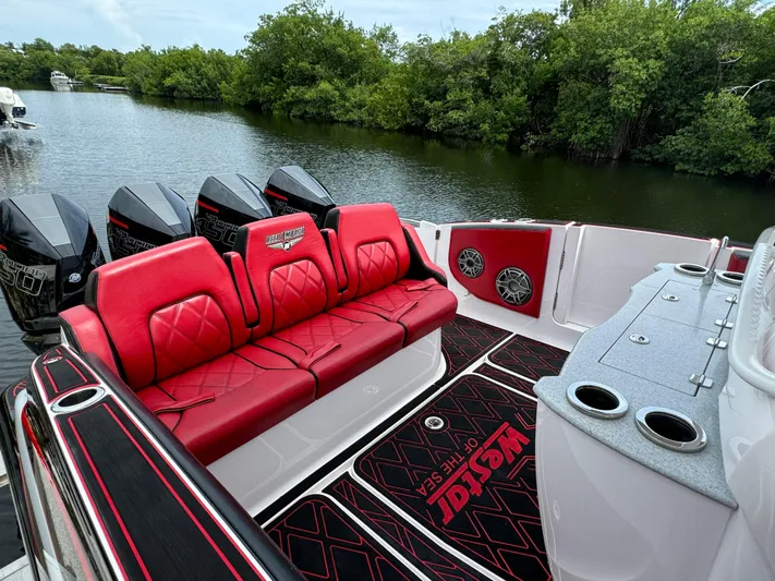  Yacht Photos Pics Luxury Deep Impact 399 boat with red seating, powerful engines, and sleek design, 2022 model.