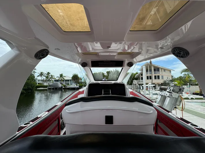  Yacht Photos Pics Interior view of 2022 Deep Impact 399 boat, featuring sleek design and waterfront setting.