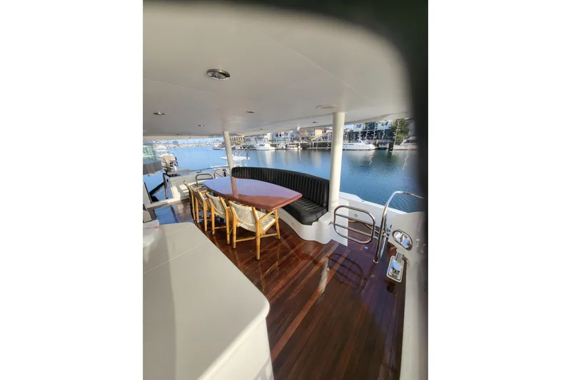 Lemonade Yacht Photos Pics Luxurious 2007 Cheoy Lee 100 yacht deck with seating and waterfront view.