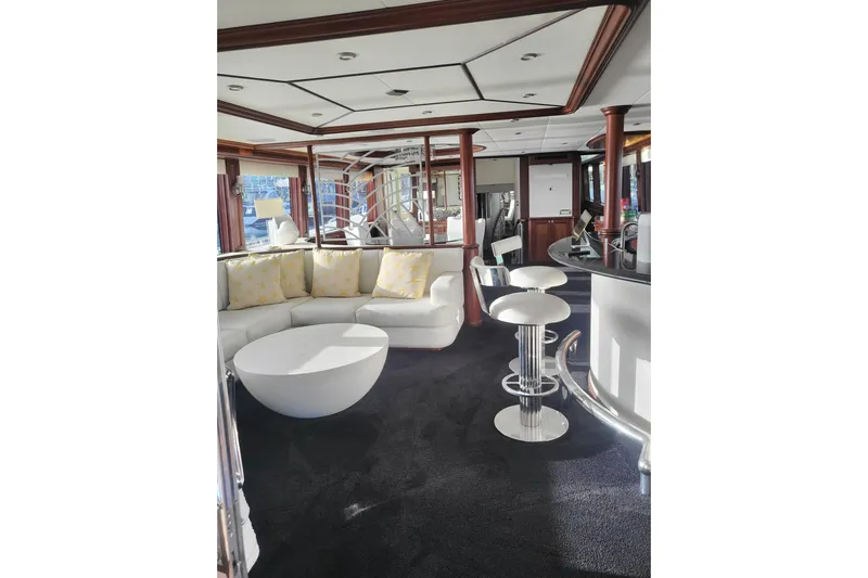 Lemonade Yacht Photos Pics Luxurious interior of 2007 Cheoy Lee 100 yacht with modern seating and elegant design.