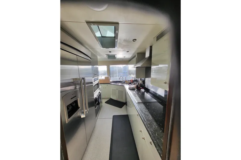 Lemonade Yacht Photos Pics Luxurious kitchen interior of 2007 Cheoy Lee 100 yacht with modern appliances.