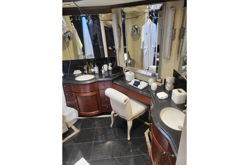 Lemonade Yacht Photos Pics Luxurious bathroom interior on a 2007 Cheoy Lee 100 yacht, featuring elegant fixtures and decor.