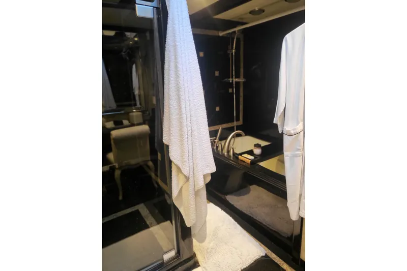 Lemonade Yacht Photos Pics Luxurious bathroom interior on 2007 Cheoy Lee 100 yacht, featuring elegant fixtures and plush towels.