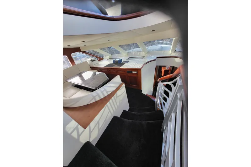 Lemonade Yacht Photos Pics Luxurious interior of 2007 Cheoy Lee 100 yacht with elegant seating and panoramic windows.