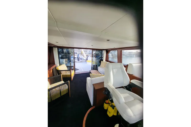 Lemonade Yacht Photos Pics Luxurious interior of 2007 Cheoy Lee 100 yacht with plush seating and panoramic windows.