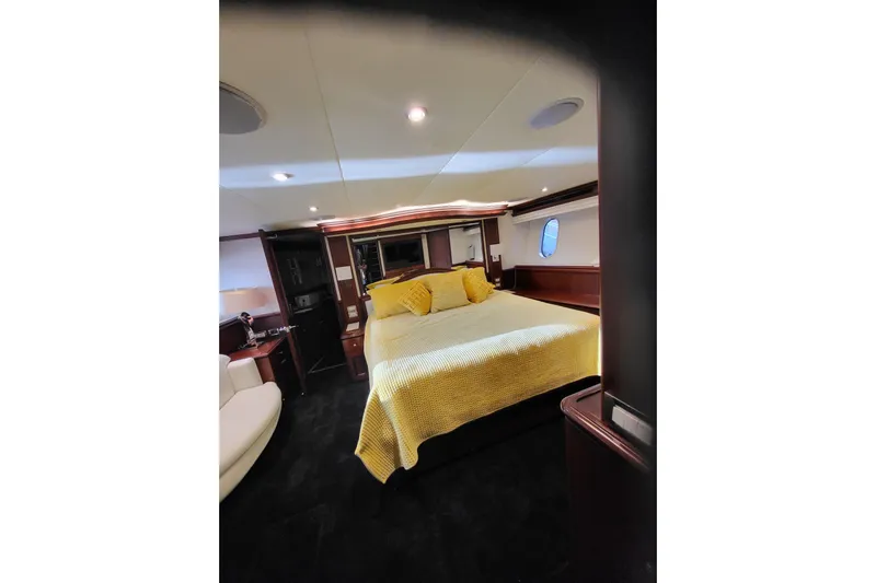 Lemonade Yacht Photos Pics Luxurious bedroom interior of 2007 Cheoy Lee 100 yacht with elegant furnishings.