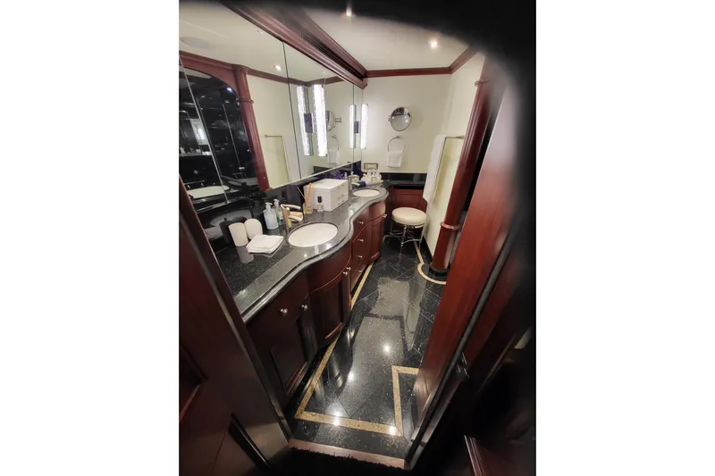 Lemonade Yacht Photos Pics Luxurious bathroom in 2007 Cheoy Lee 100 yacht with elegant wood and marble finishes.