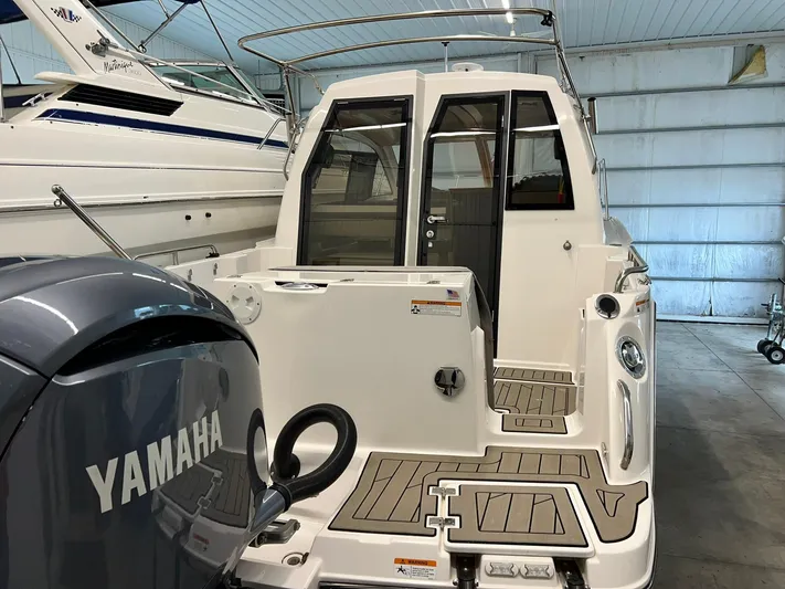  Yacht Photos Pics 2022 Cutwater C-24 Coupe with Yamaha engine in a storage facility.