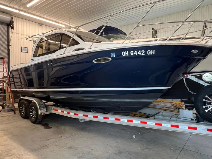  Yacht Photos Pics 2022 Cutwater C-24 Coupe boat on trailer in indoor storage.