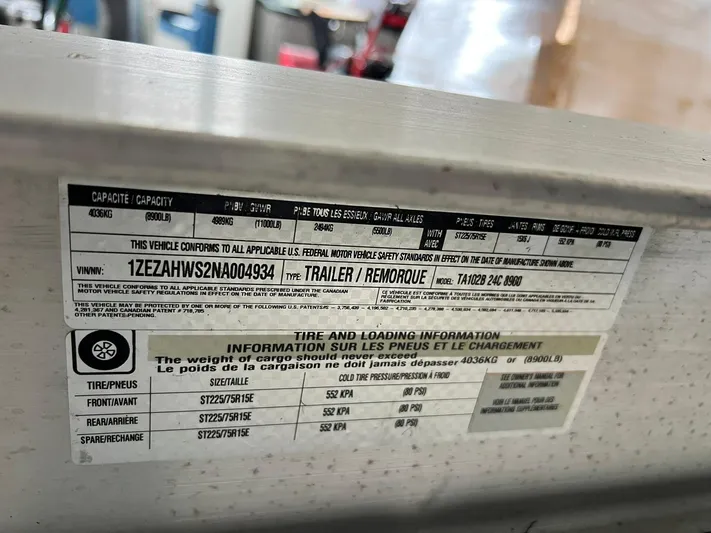  Yacht Photos Pics Label on 2022 Cutwater C-24 Coupe trailer with tire and loading information.