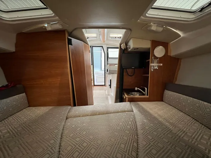  Yacht Photos Pics Interior of 2022 Cutwater C-24 Coupe boat with cozy seating and compact kitchenette.