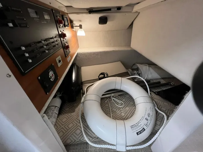  Yacht Photos Pics 2022 Cutwater C-24 Coupe interior with control panel and life ring.