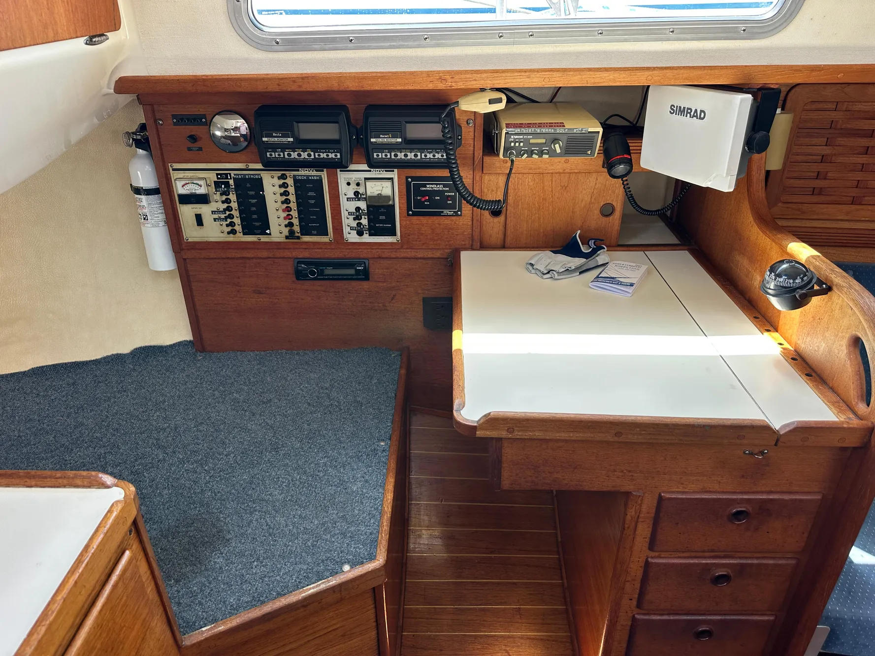 Navigation station of a 1985 Sabre 34 MKI sailboat with control panels and equipment.