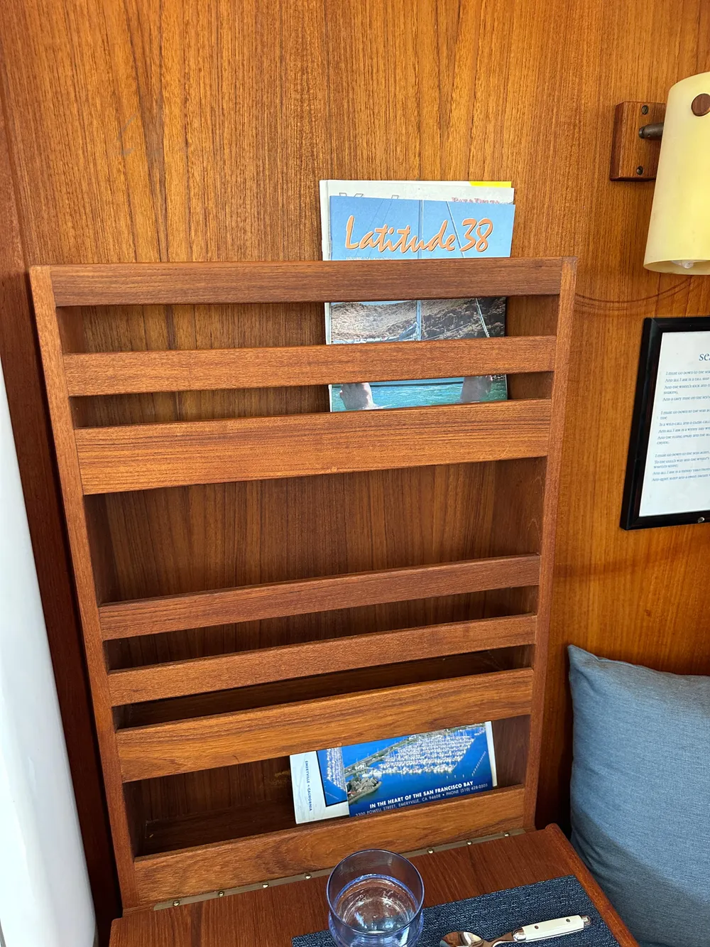 Wooden magazine rack in a 1985 Sabre 34 MKI sailboat interior.