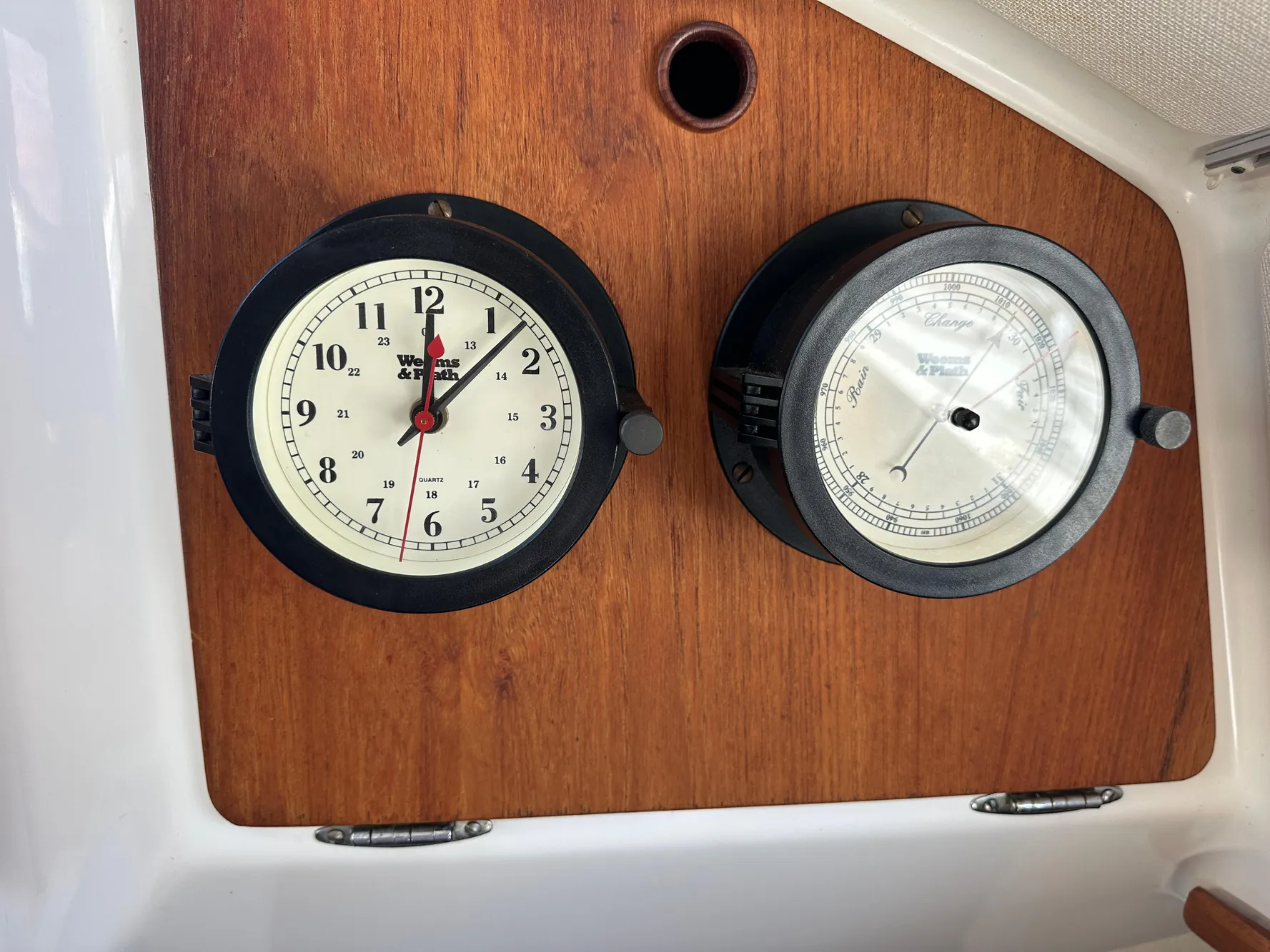 Clock and barometer on 1985 Sabre 34 MKI wooden panel.