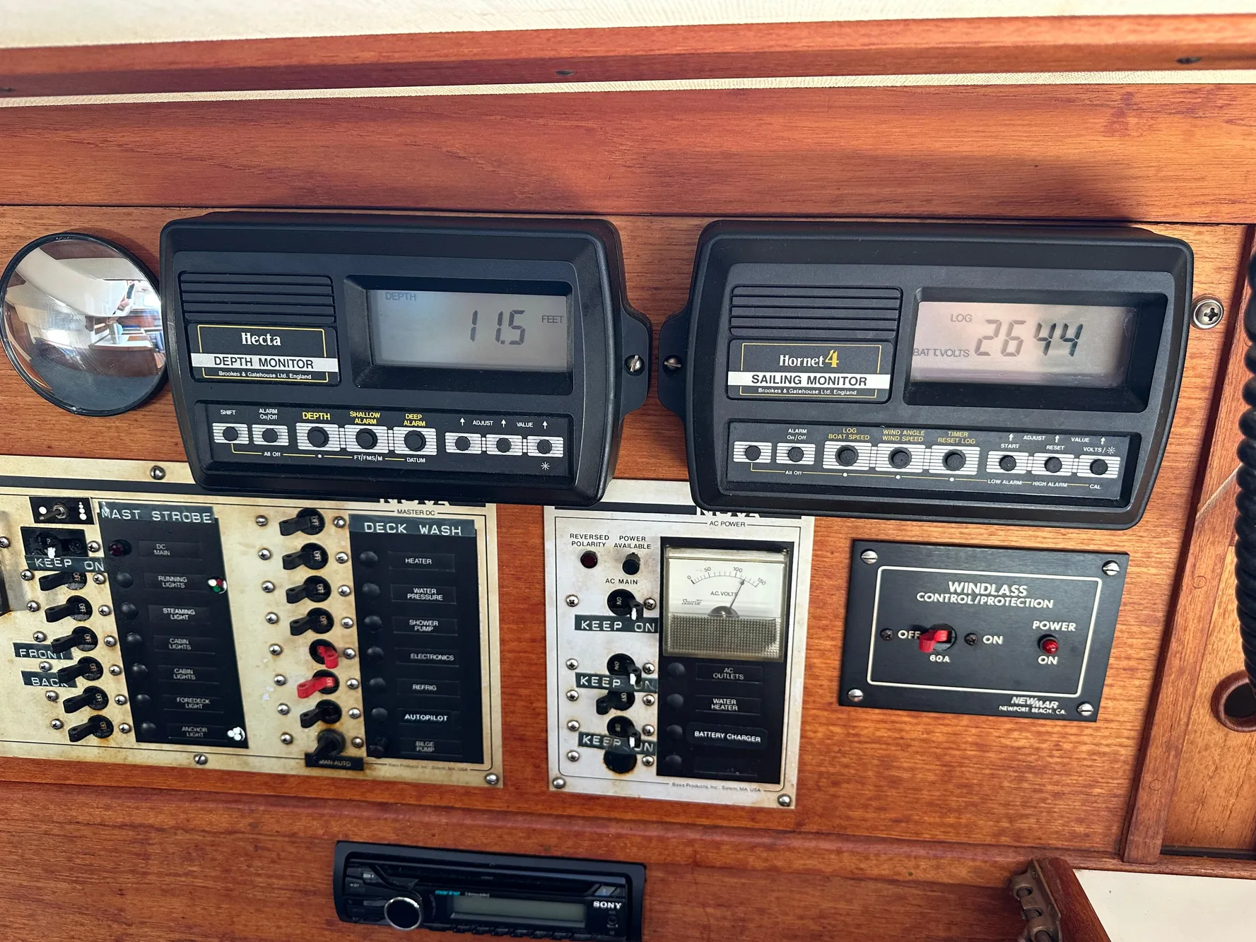 Control panel of a 1985 Sabre 34 MKI sailboat with depth and sailing monitors.