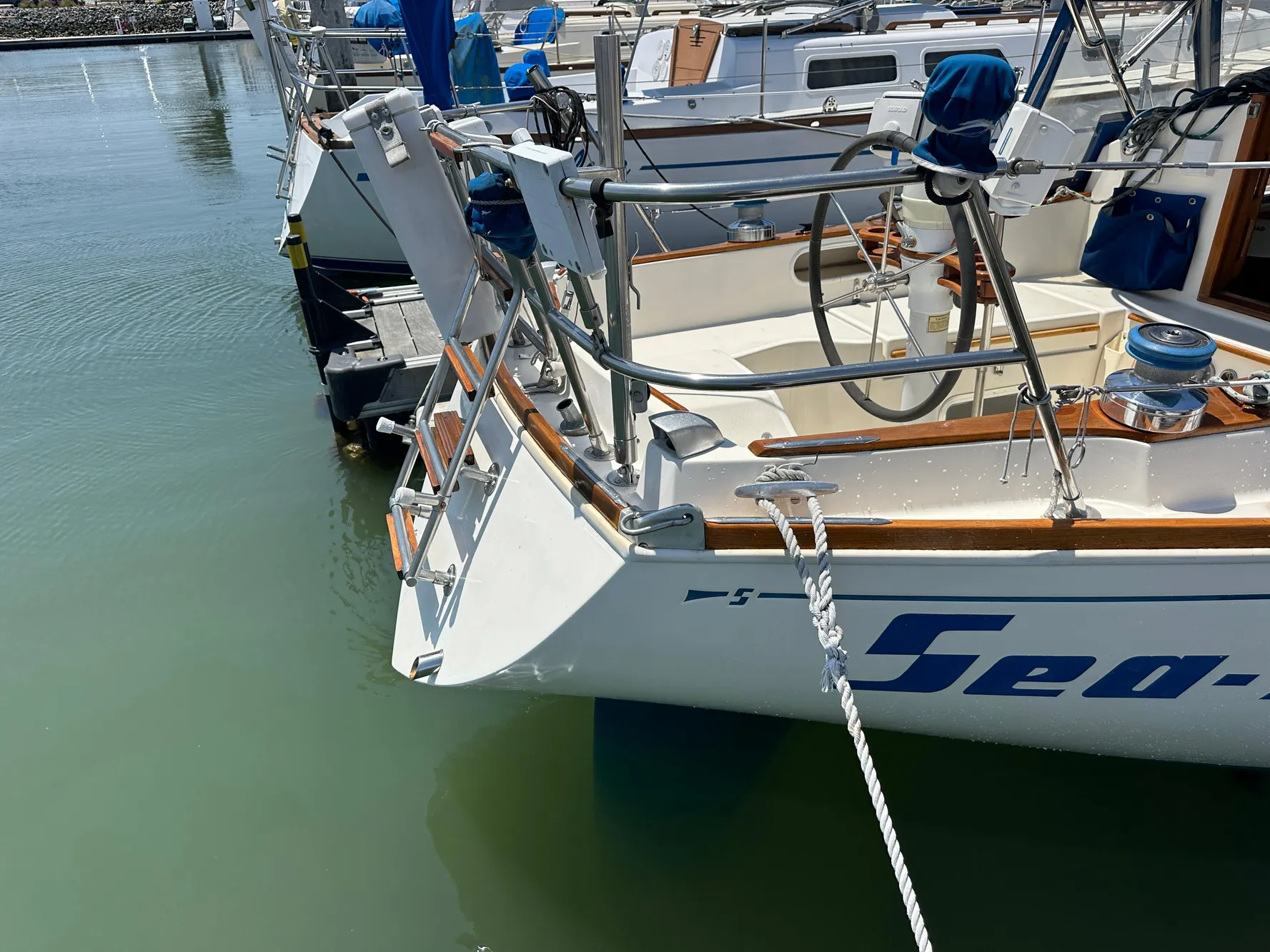 1985 Sabre 34 MKI sailboat docked, featuring a clean deck and mooring line.
