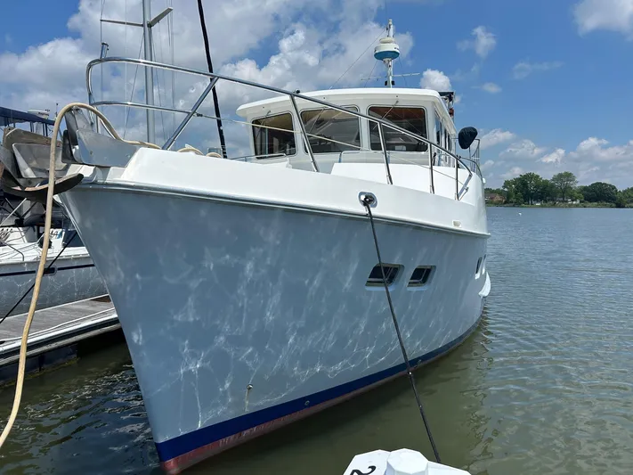 Duet Yacht Photos Pics 1999 Selene 43 yacht docked on a sunny day with clear skies.