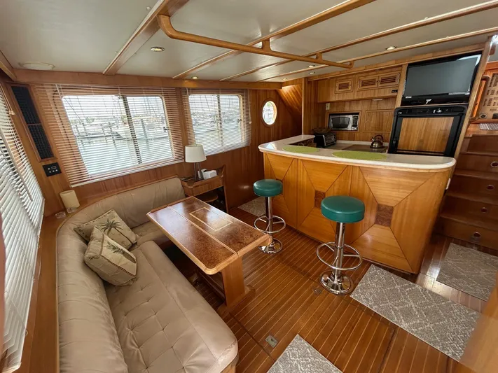 Duet Yacht Photos Pics Luxurious interior of 1999 Selene 43 yacht with cozy seating and modern amenities.