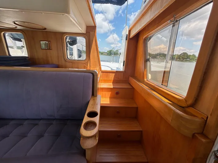 Duet Yacht Photos Pics Interior of 1999 Selene 43 yacht with wooden stairs and seating.