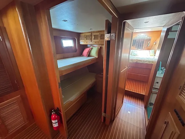 Duet Yacht Photos Pics Interior of 1999 Selene 43 yacht with wooden bunk beds and bathroom.