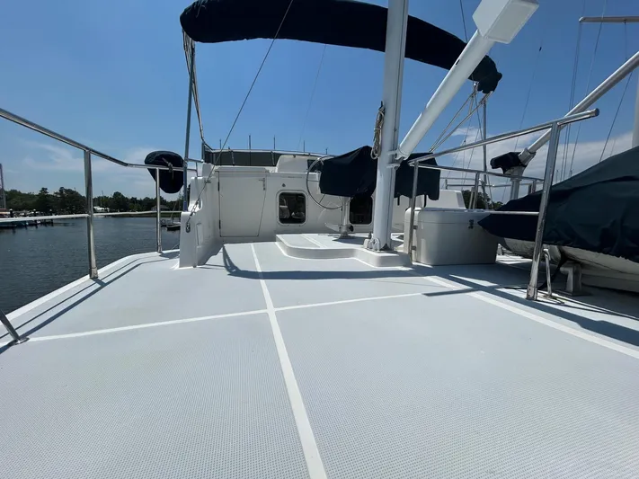 Duet Yacht Photos Pics Selene 43 yacht deck, 1999 model, with blue canopy, docked by the water.