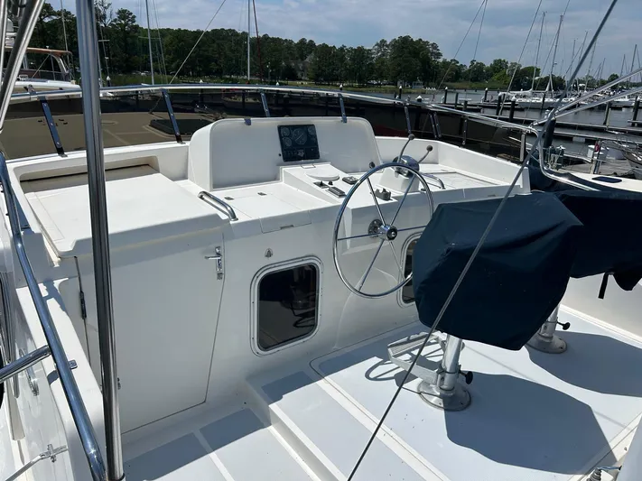 Duet Yacht Photos Pics Cockpit of 1999 Selene 43 yacht with steering wheel and covered seats.
