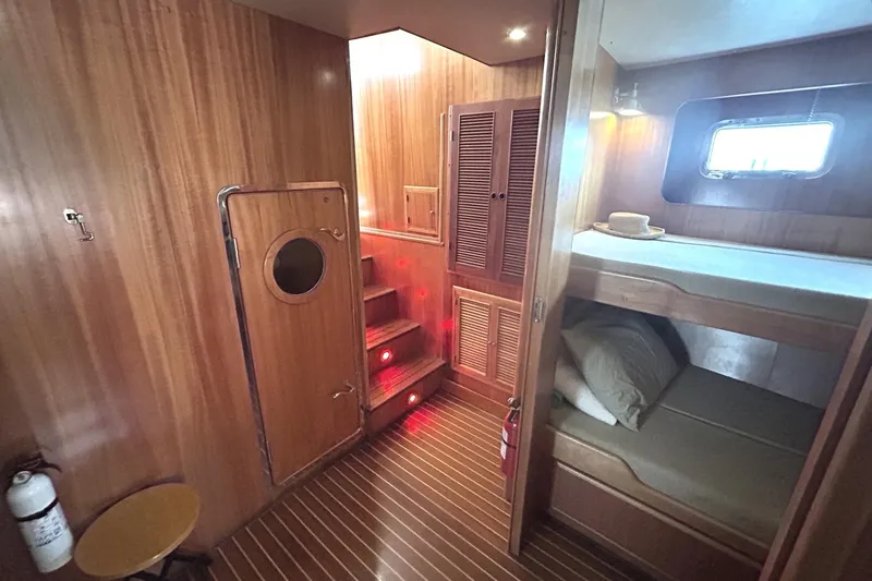 Duet Yacht Photos Pics Cozy wooden interior of 1999 Selene 43 yacht with bunk beds and stairs.