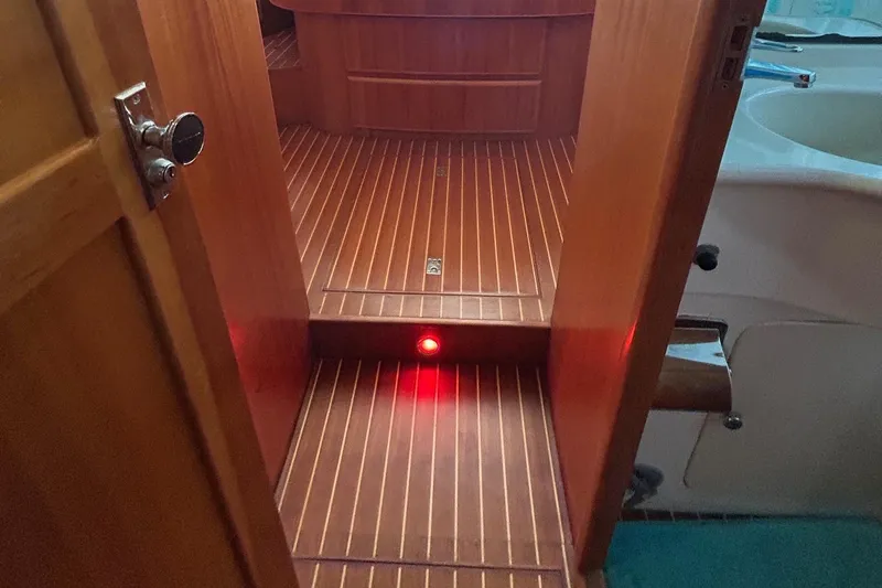 Duet Yacht Photos Pics Wooden interior of 1999 Selene 43 yacht with red floor light.