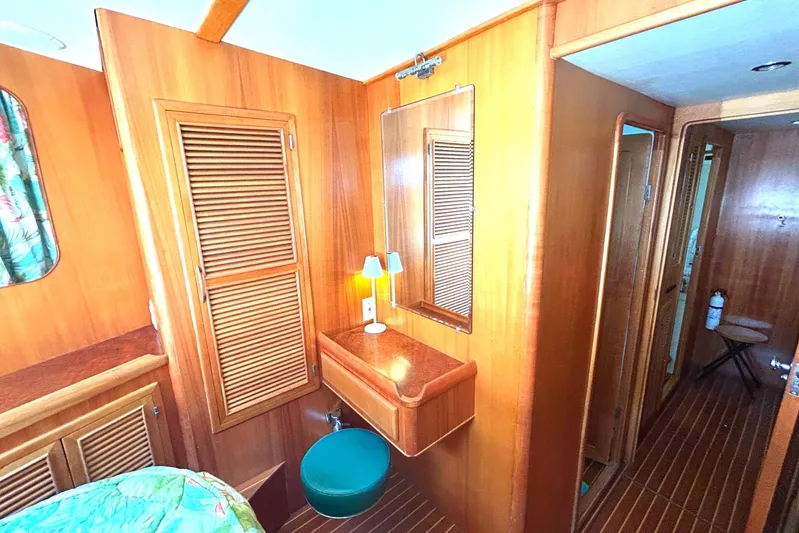 Duet Yacht Photos Pics Cozy wooden interior of 1999 Selene 43 yacht with vanity and seating.