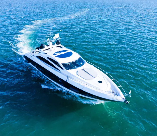 The Gambler Yacht Photos Pics Luxury Sunseeker Predator 82 yacht cruising on open water, 2006 model.