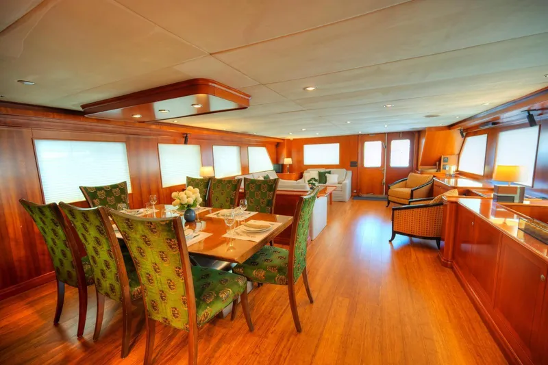 Voyager Yacht Photos Pics Luxurious 2004 Algar Explorer yacht interior with elegant dining area and plush seating.