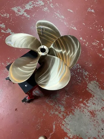 L Altro G Yacht Photos Pics Propeller for 2006 Cranchi Atlantique 48 on red floor.