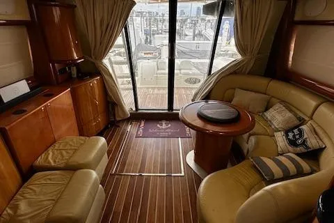 L Altro G Yacht Photos Pics Luxurious interior of 2006 Cranchi Atlantique 48 yacht with leather seating and wooden flooring.