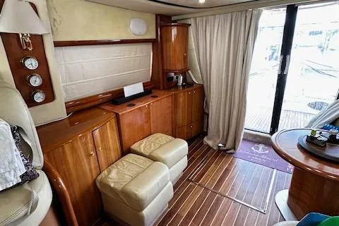 L Altro G Yacht Photos Pics Luxurious interior of 2006 Cranchi Atlantique 48 yacht with wooden cabinetry and leather seating.