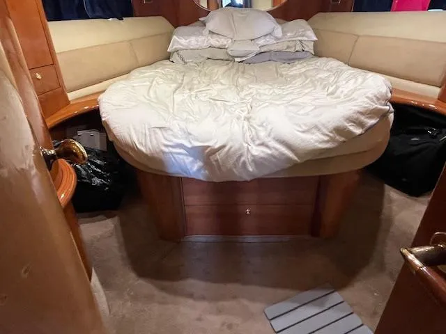 L Altro G Yacht Photos Pics Luxurious cabin interior of 2006 Cranchi Atlantique 48 yacht with cozy bedding.